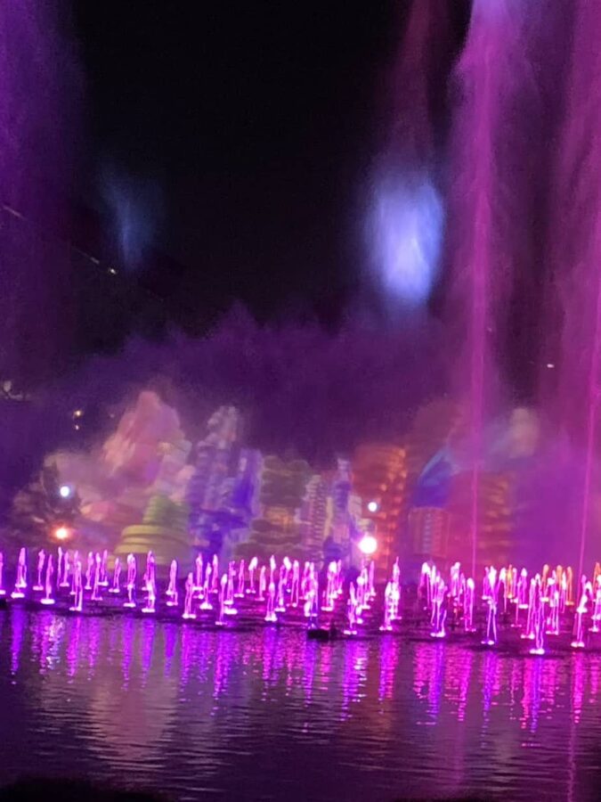 World of Color show at Disney California Adventure Park. Shows projections of buildings to illustrate choices to be made when booking a Disneyland Resort Hotel.