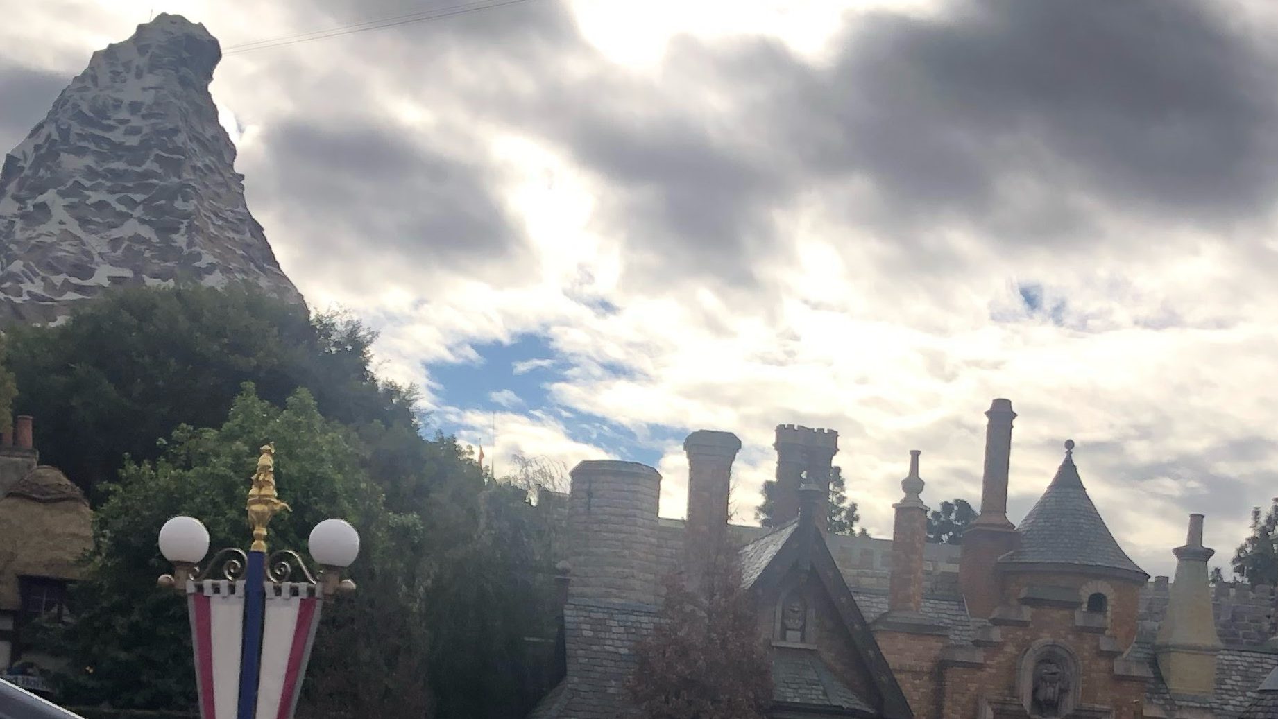 Clouds in the sky above Fantasyland and Matterhorn Mountain at Disneyland Park