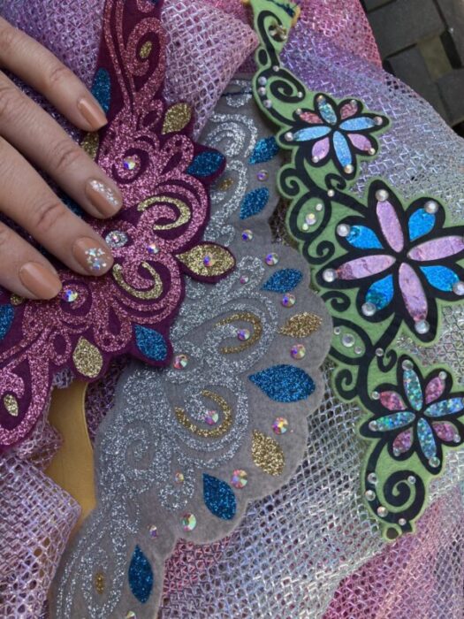 Sparkly Disney Princess nails on soft and stretchy princess tiaras for comfortable Disneyland costume idea. They are small flat and easily packable to help someone pack light for Disneyland.