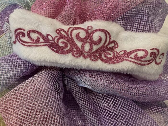 Fleece headband with glitter crown tiara vinyl appliqué ironed on to it,