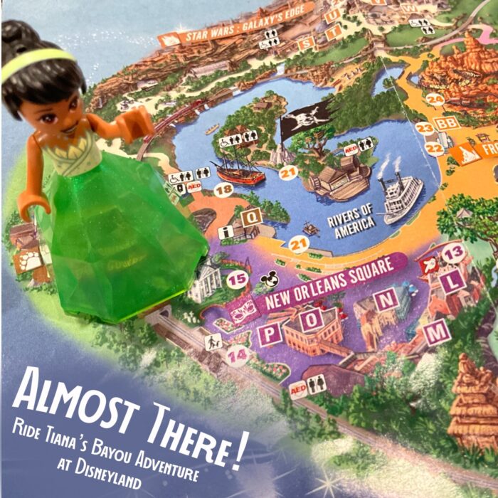 Tiana’s Bayou Adventure at Disneyland in California is opening on November 15, 2024. This photo shows a Lego Tiana figure on a Disneyland map with the title “Almost There! Ride Tiana’s Bayou Adventure at Disneyland” to show the purpose of this article.