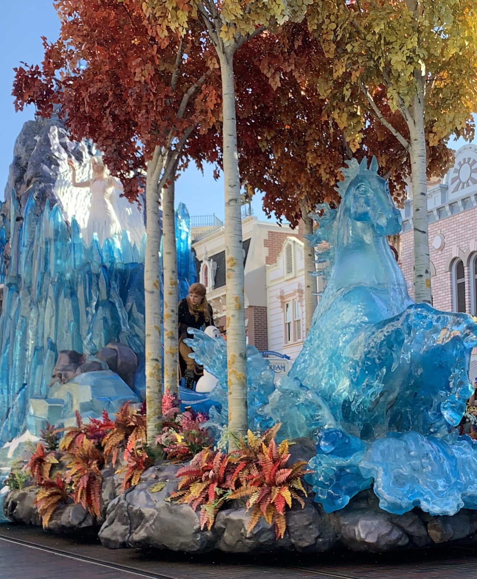 Photo of Frozen II float in parade at Disneyland for article on staying warm on cold days in Disneyland Park and Disney California Adventure Park.