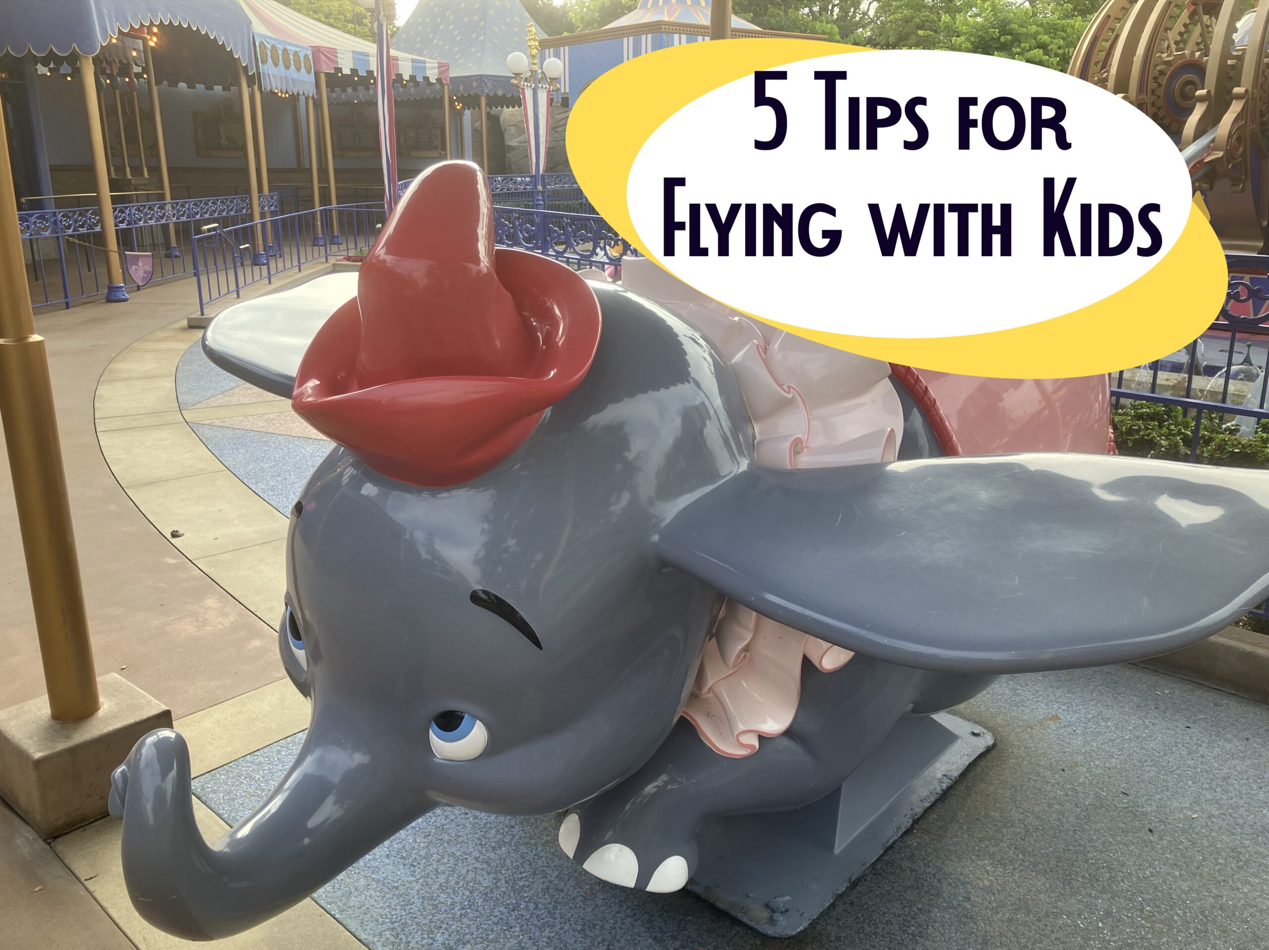 Photo of Dumbo attraction at Disneyland with title “5 Tips for Flying with Kids” to illustrate MouseBrief article on air travel with children.