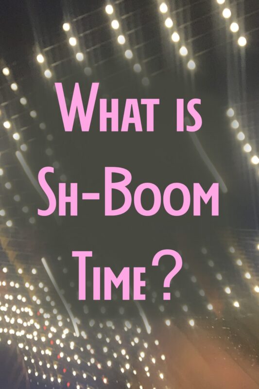 Nigthttime photo showing light bulbs with text over the top “What is Sh-Boom Time?’