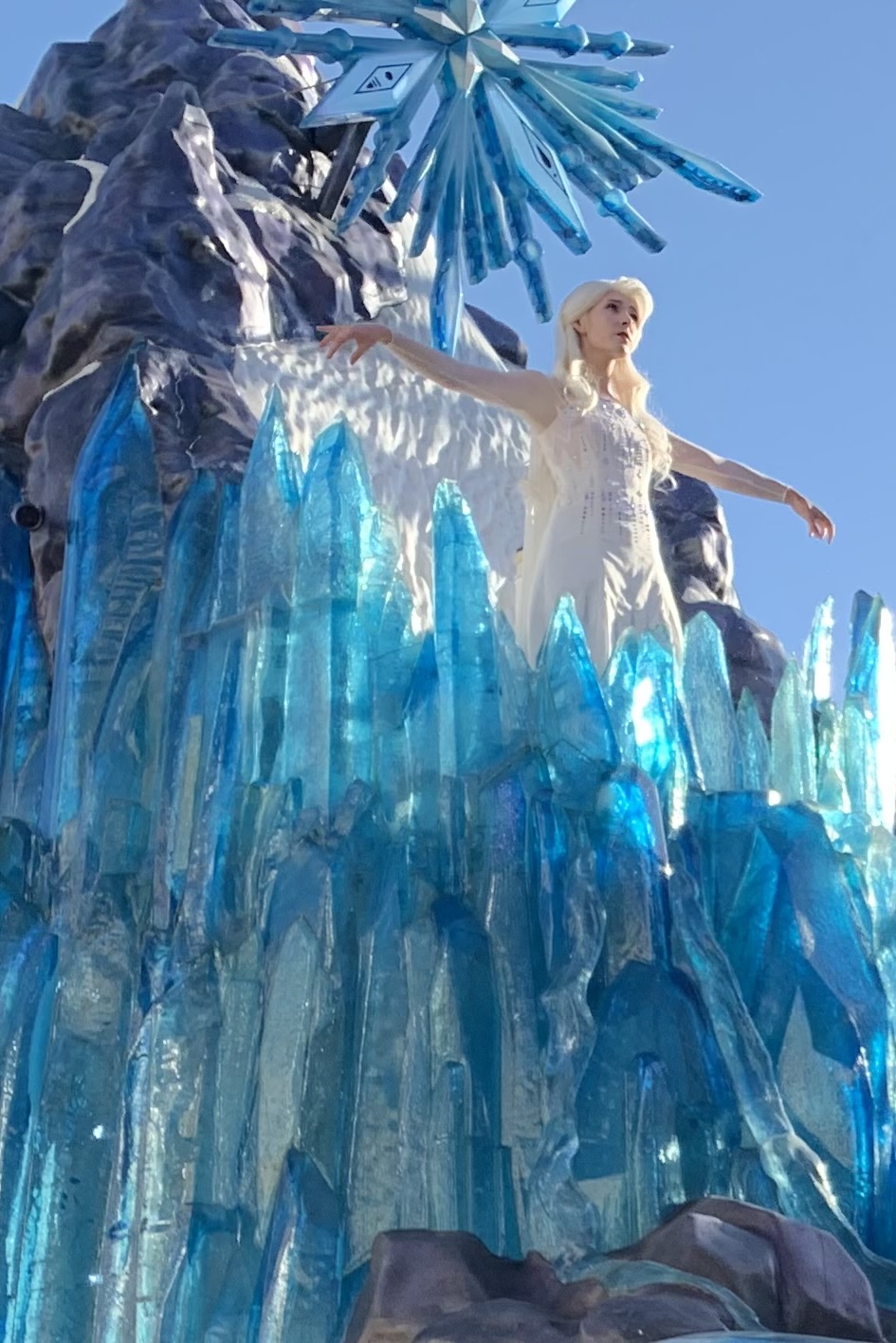 Photo of Elsa on a Frozen float in Disneyland for post answering the question: Does it snow in Disneyland?