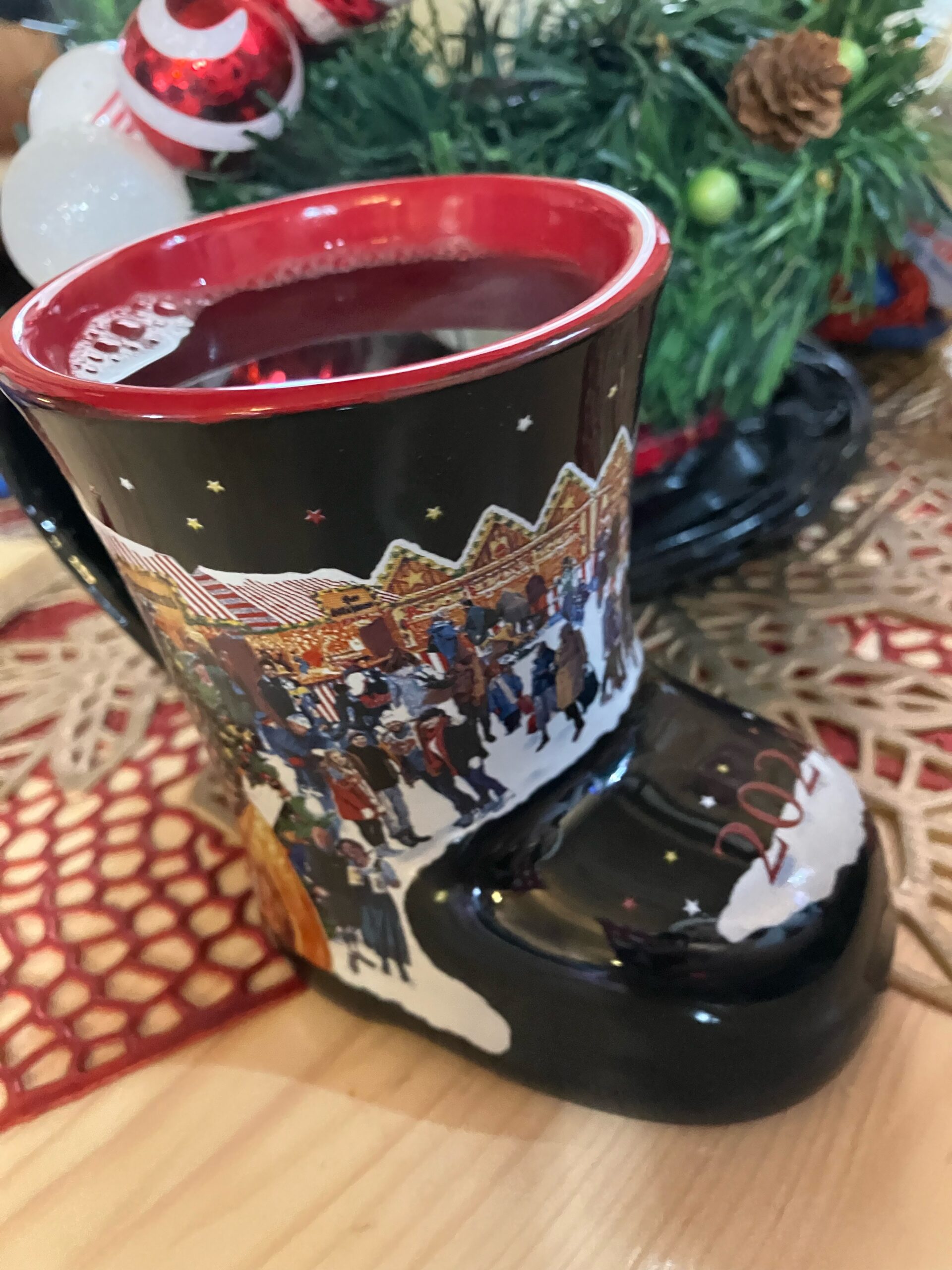 Glühwein in boot mug from Christkindlmarket Aurora.. Hot spiced mulled wine in a boot shaped souvenir mug.