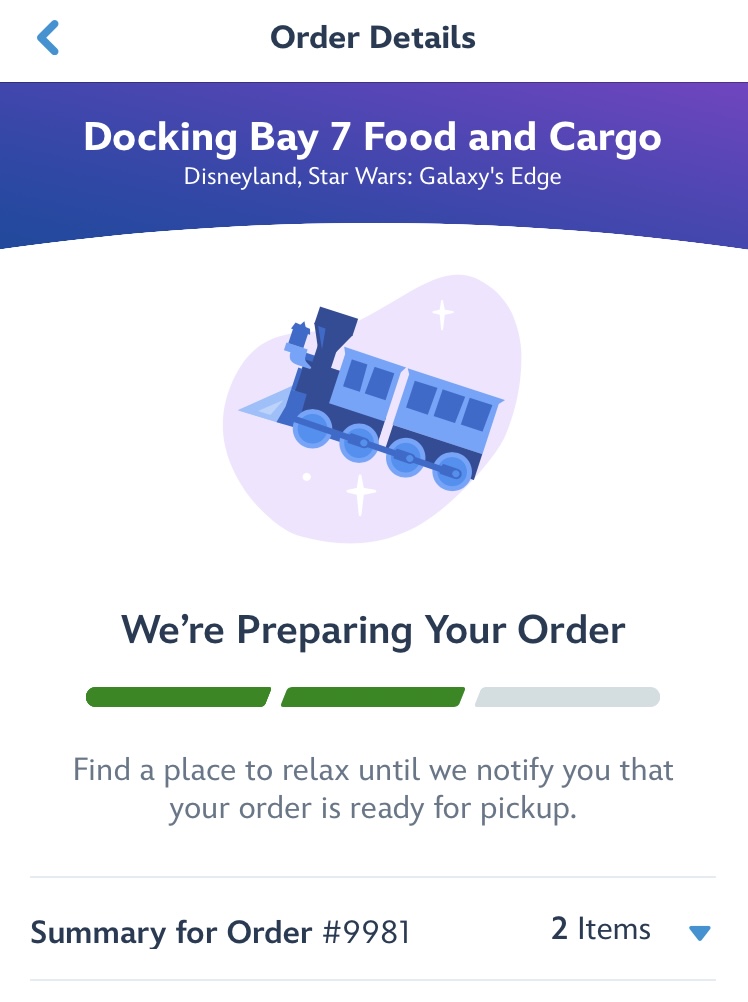 Screenshot from mobile ordering process at Disneyland Resort showing screen saying “We’re preparing your order”